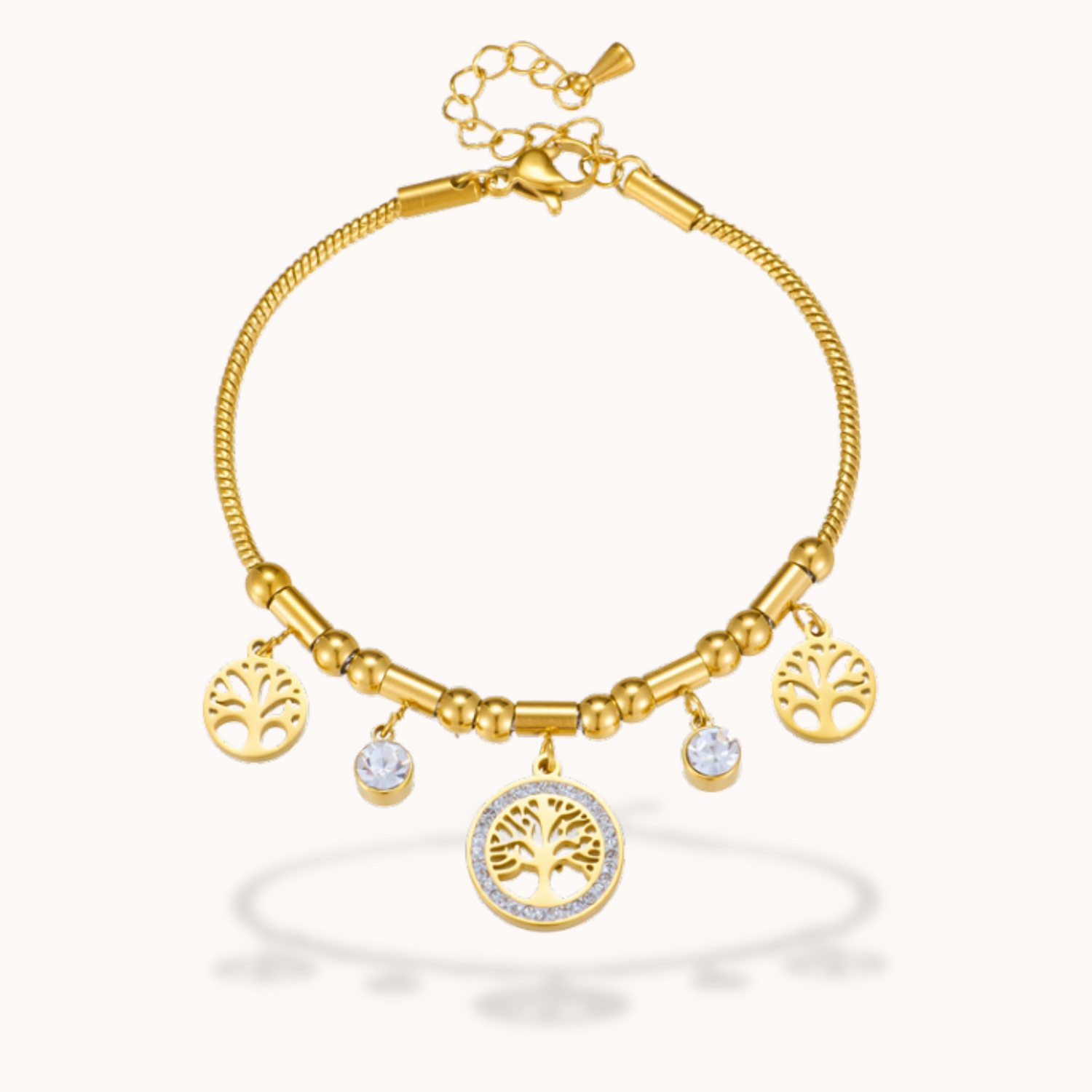 Gold bracelet with tree of life charms on a white background