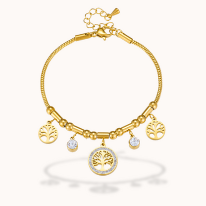 Gold bracelet with tree of life charms on a white background