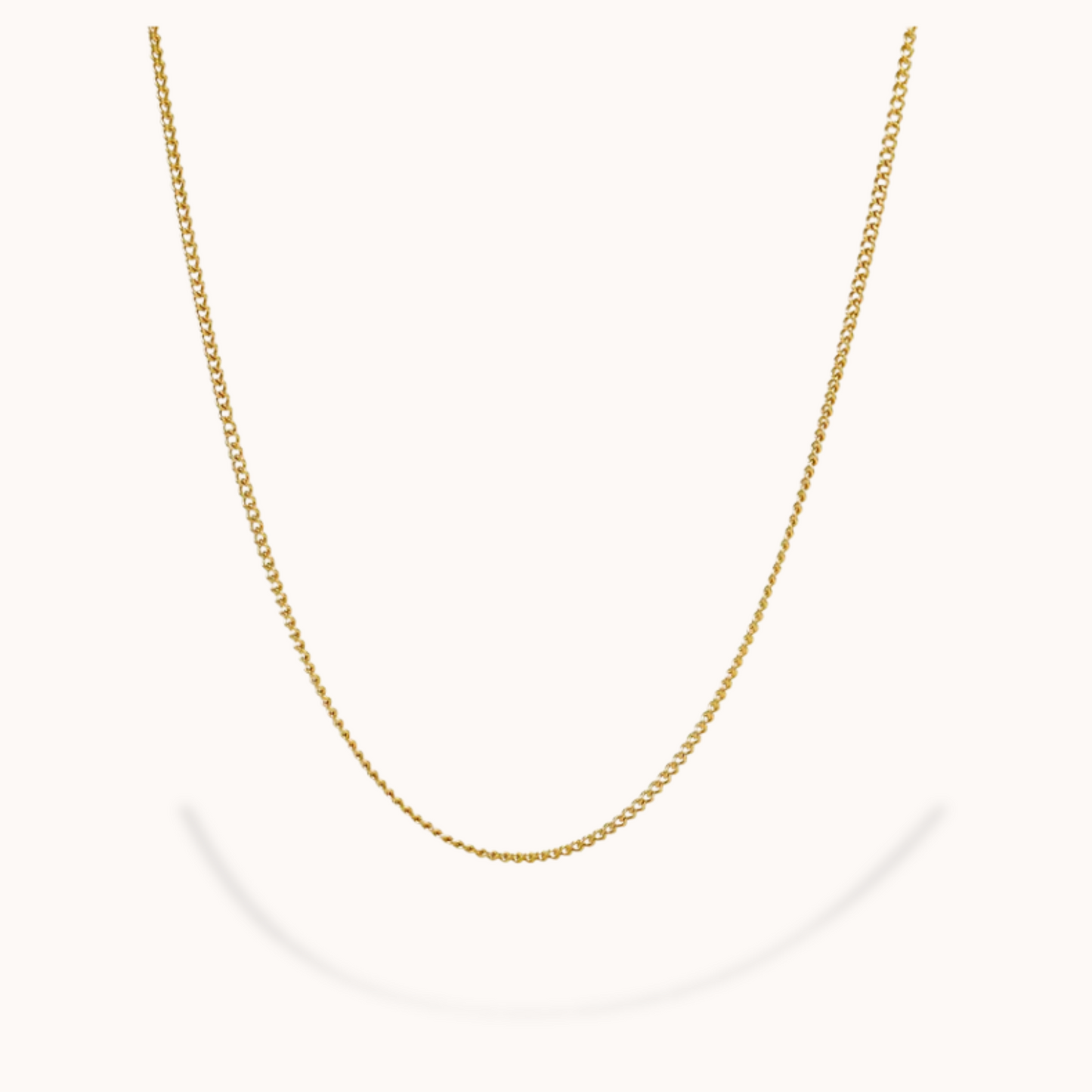 Gold chain necklace on a white background