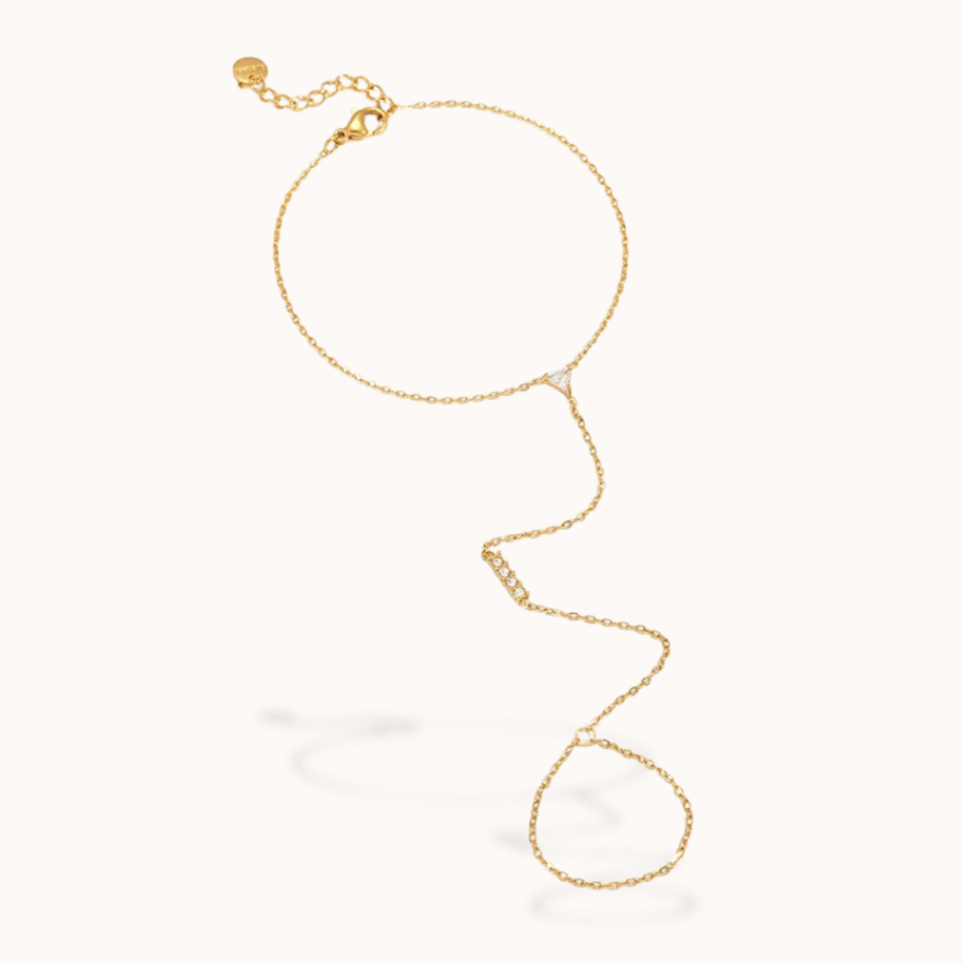 Gold ring chain bracelet on a white background