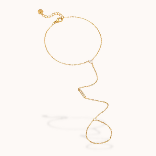 Gold ring chain bracelet on a white background