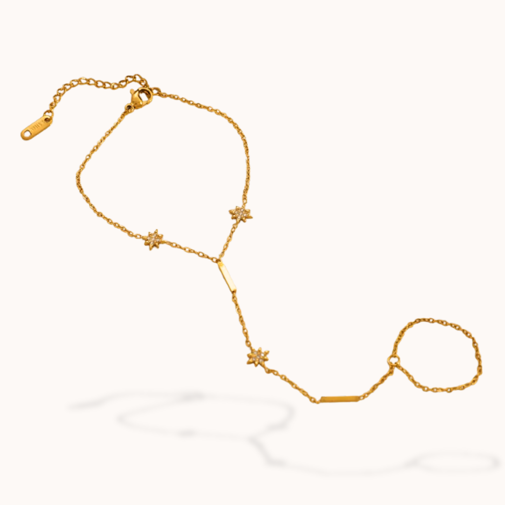 Gold chain bracelet with star-shaped links on a white background