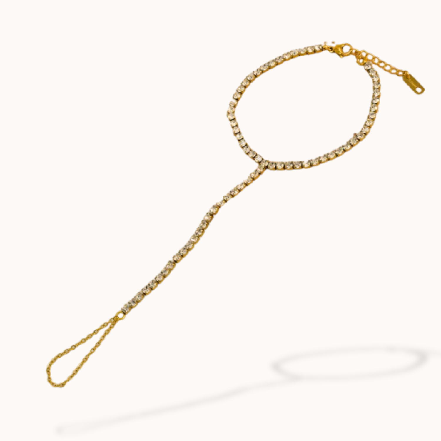 Gold chain with a decorative clasp on a white background