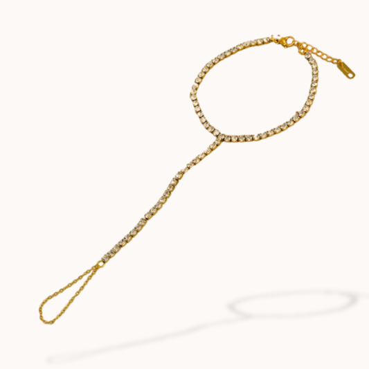 Gold chain with a decorative clasp on a white background