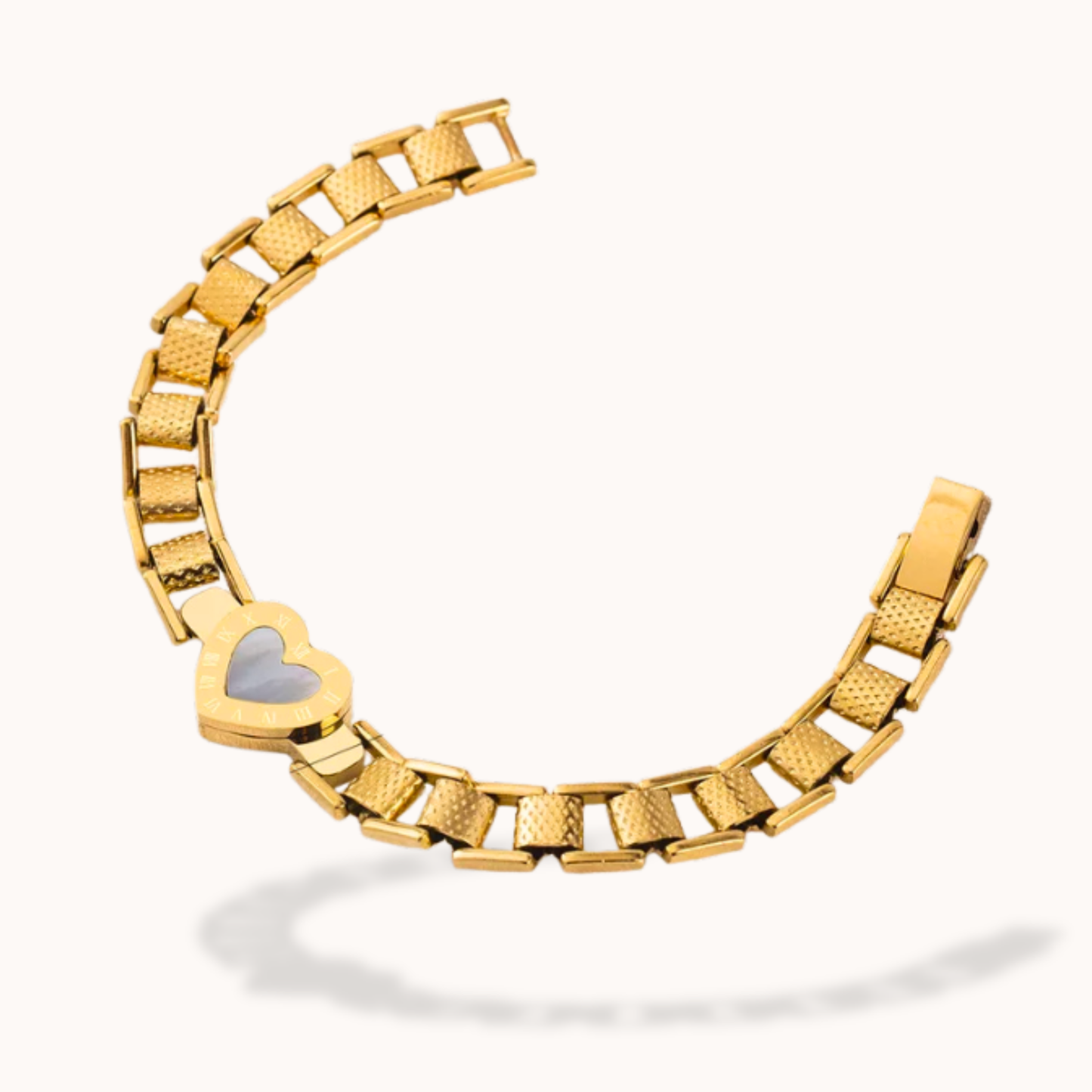 Gold bracelet with a heart-shaped clasp on a white background