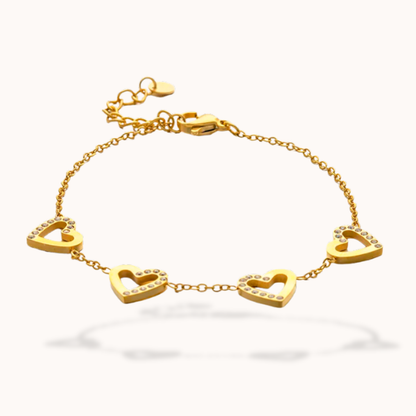 Gold bracelet with heart-shaped links on a white background