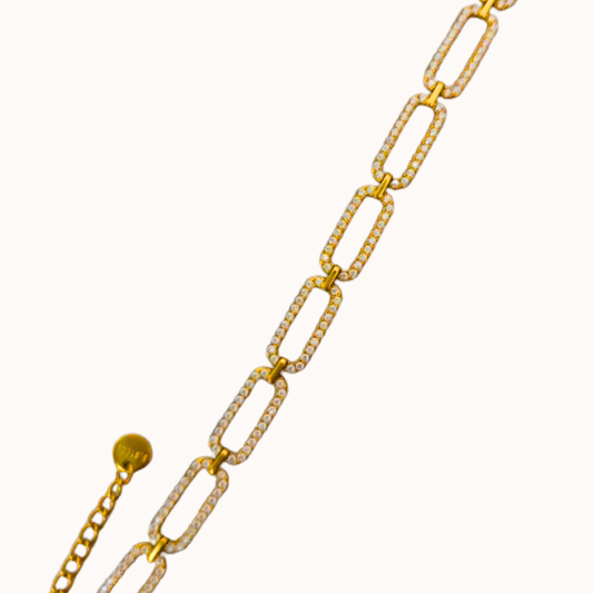 Gold chain necklace on a white background