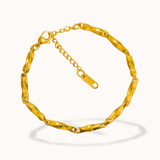 Gold bracelet on a white background