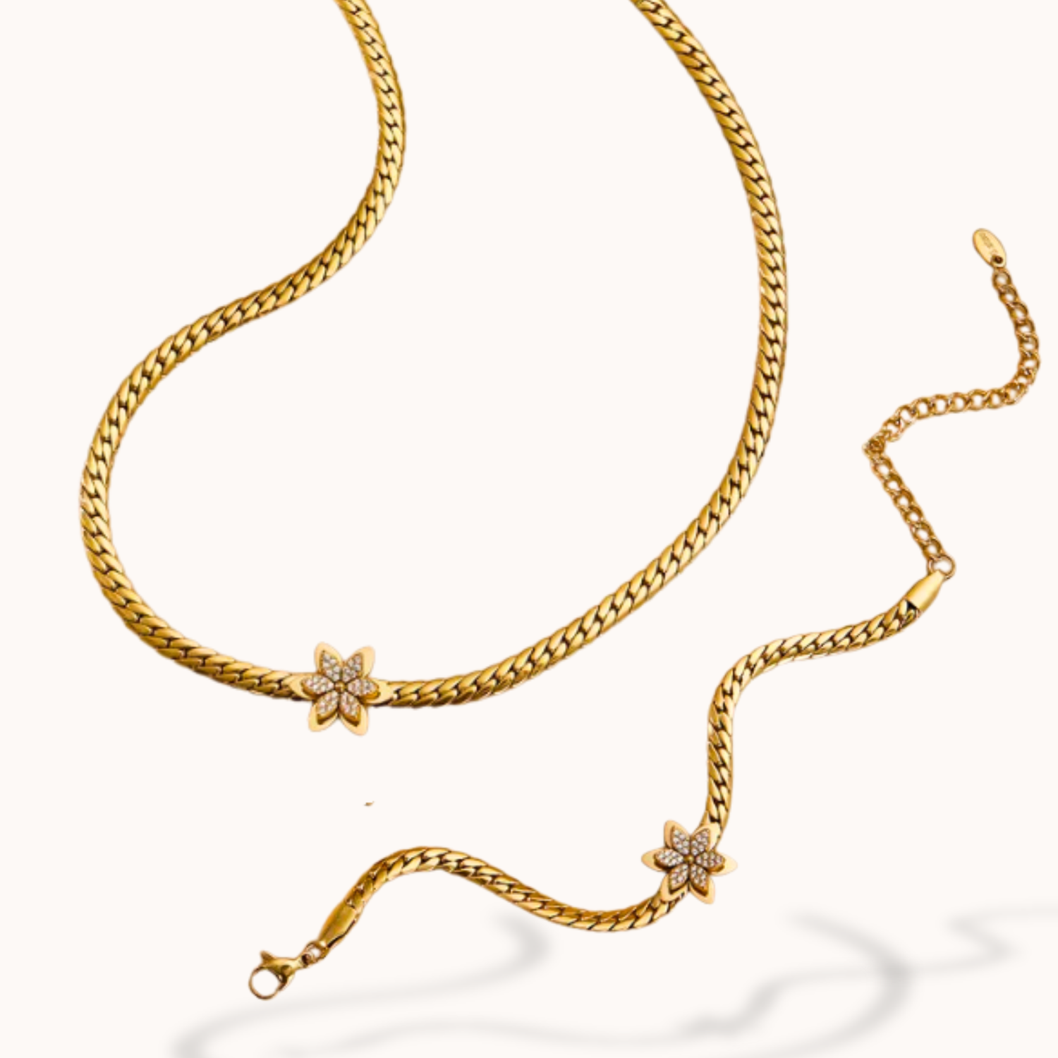 Gold chain necklace with star-shaped pendants on a white background