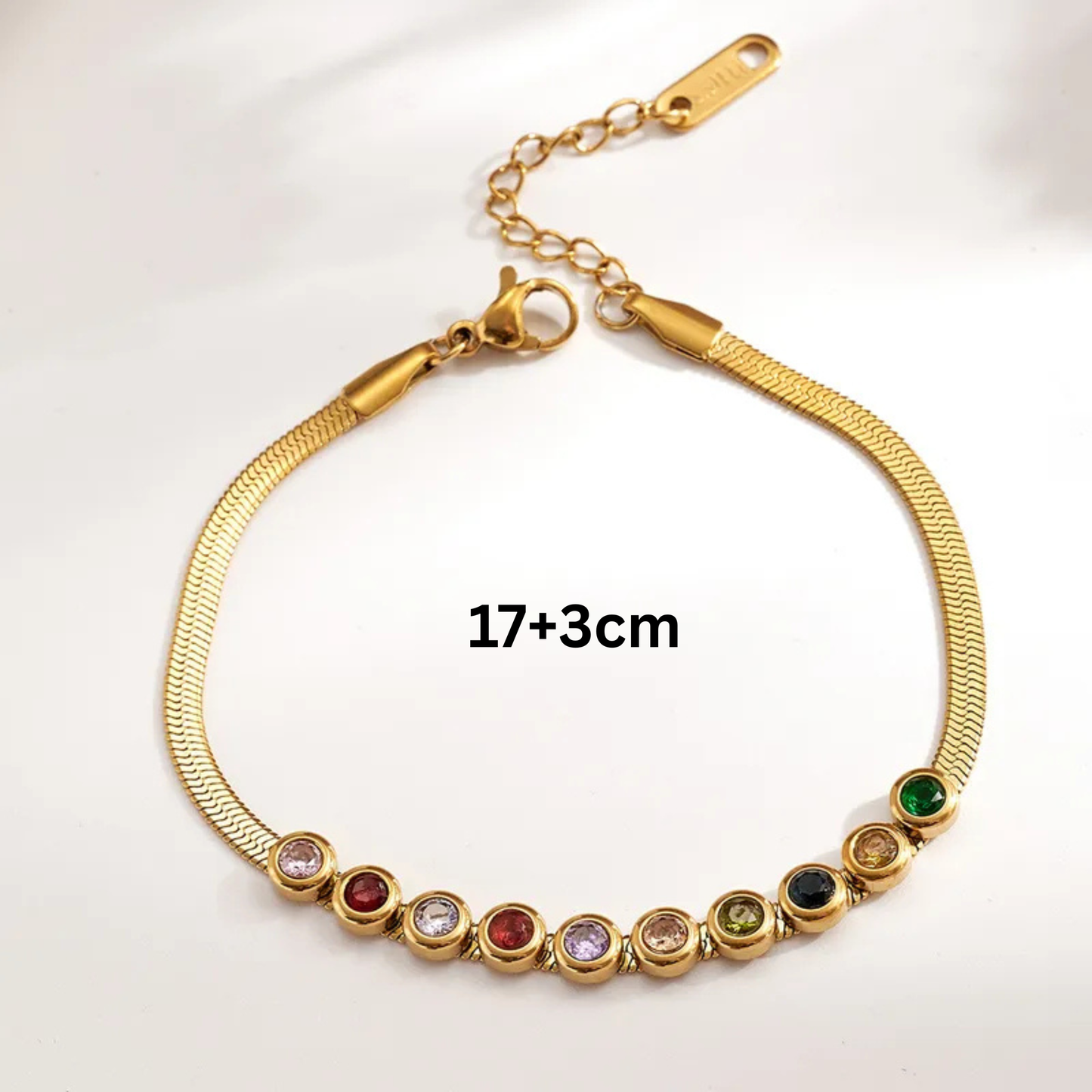 Gold bracelet with colorful beads on a white background