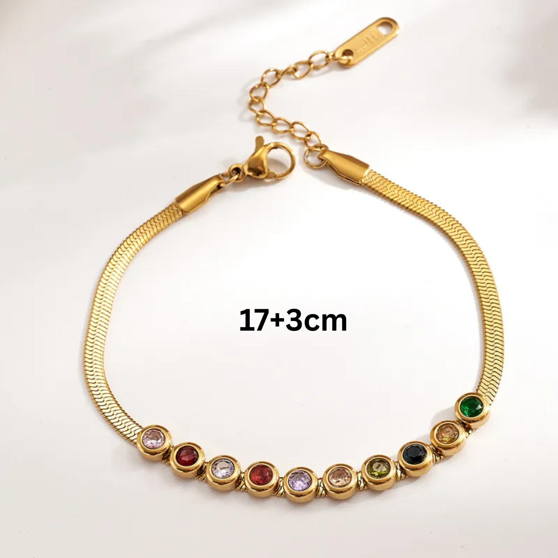 Gold bracelet with colorful beads on a white background
