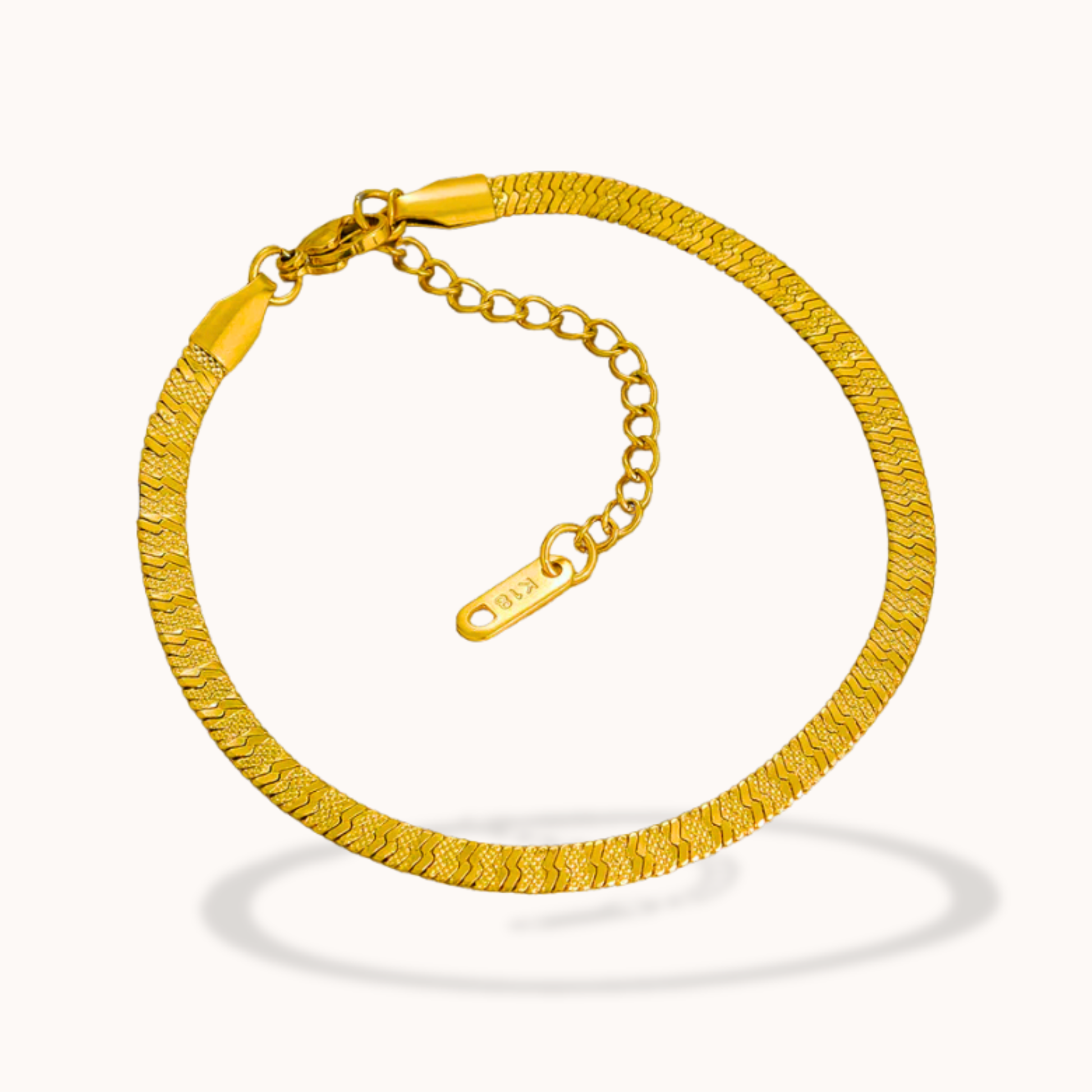 Gold bracelet on a white background