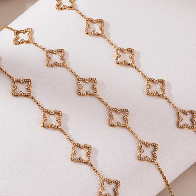 Rose gold chain necklace on a white surface
