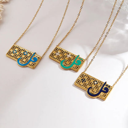 Three gold necklaces with Arabic calligraphy pendants on a white background