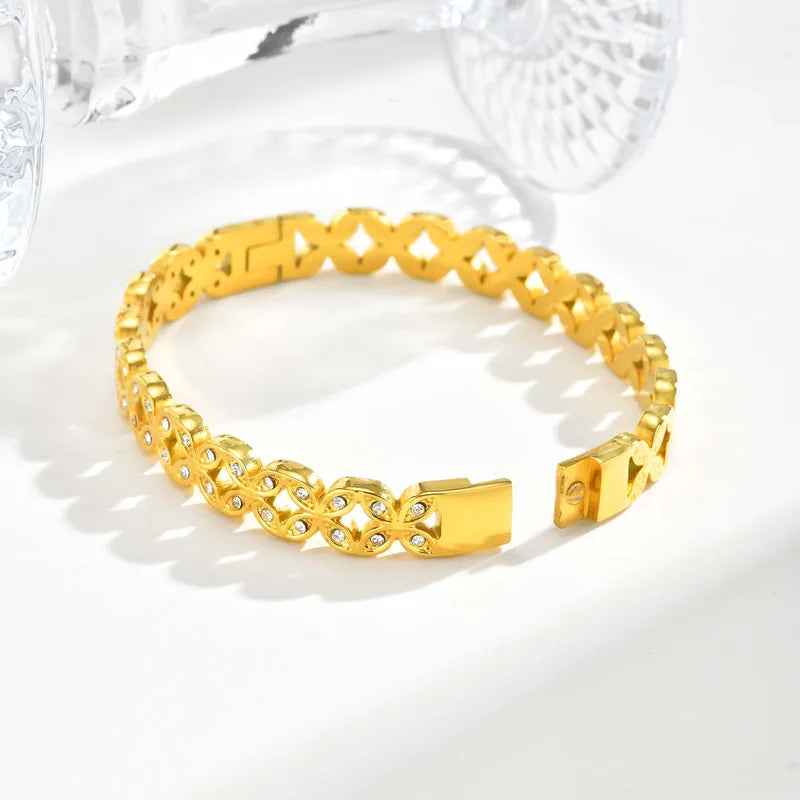 Gold bracelet on a white background