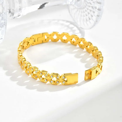 Gold bracelet on a white background