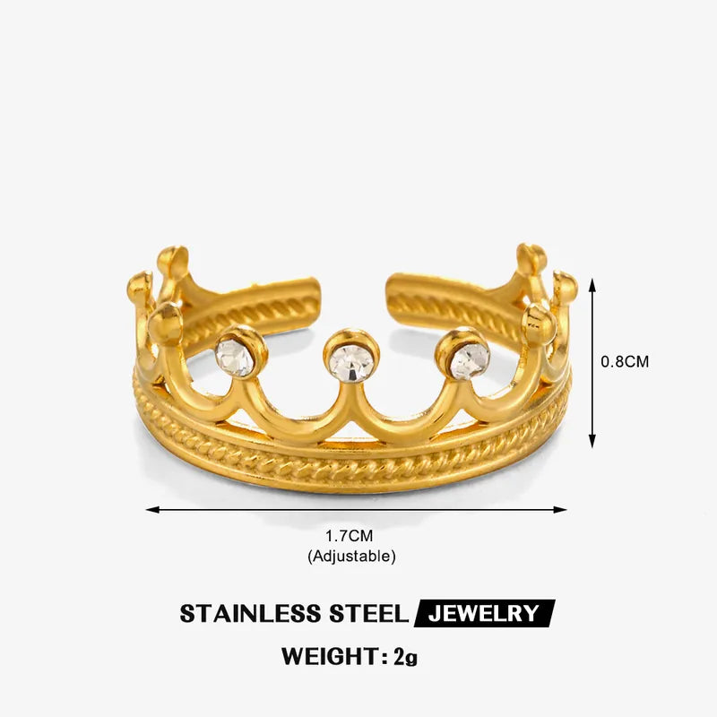 Gold crown-shaped bracelet with measurements on a white background