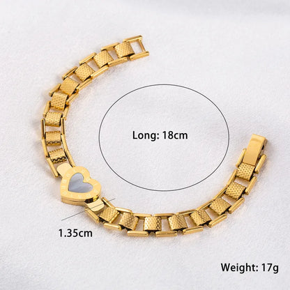 Gold bracelet with heart detail on a white background, showing measurements.