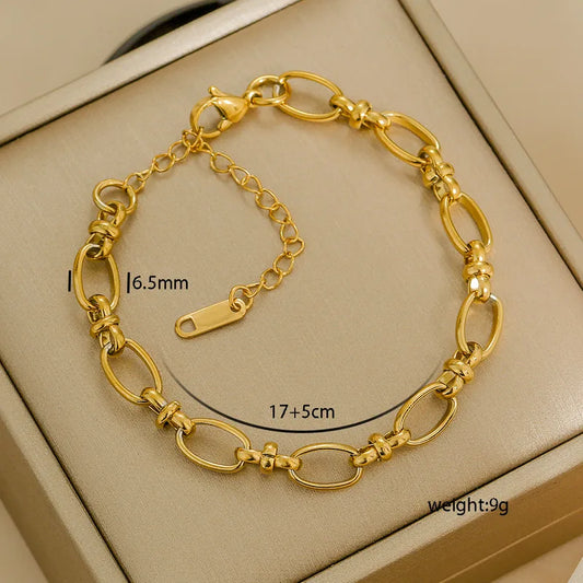 Gold bracelet on a beige background with measurements and weight displayed.