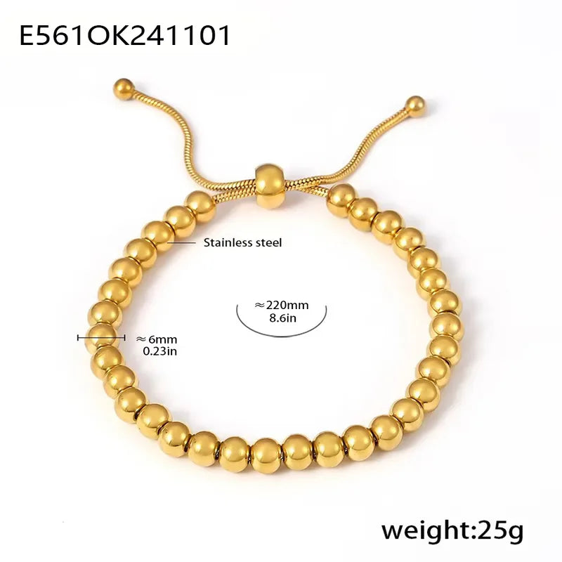 Gold beaded bracelet with measurement details on a white background