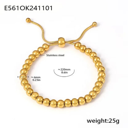 Gold beaded bracelet with measurement details on a white background