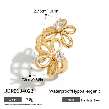 Gold ring with butterfly design and measurements on a white background