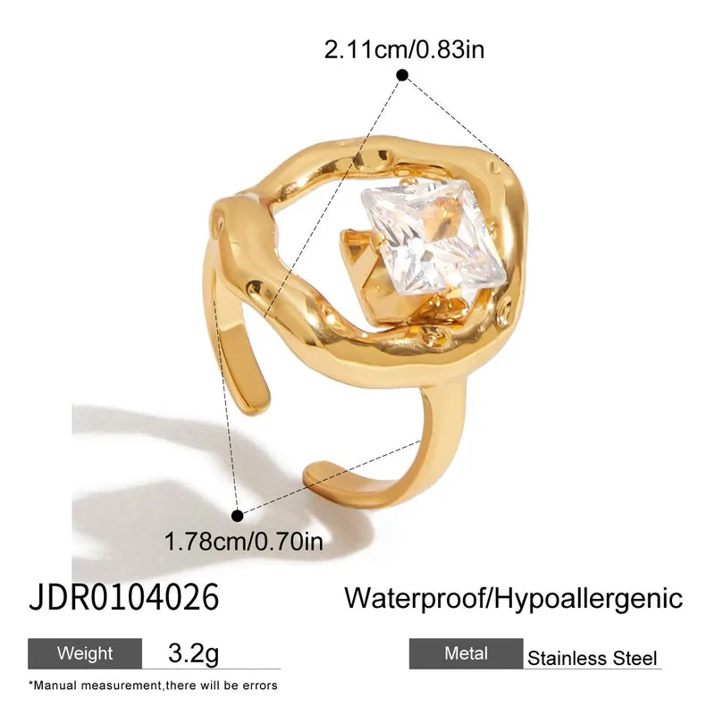 Gold ring with a clear gemstone, showing measurements and product details on a white background.