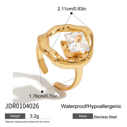Gold ring with a clear gemstone, showing measurements and product details on a white background.