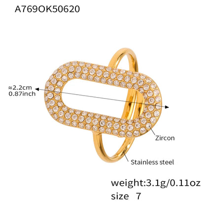 Gold ring with zircon stones and product details on a white background