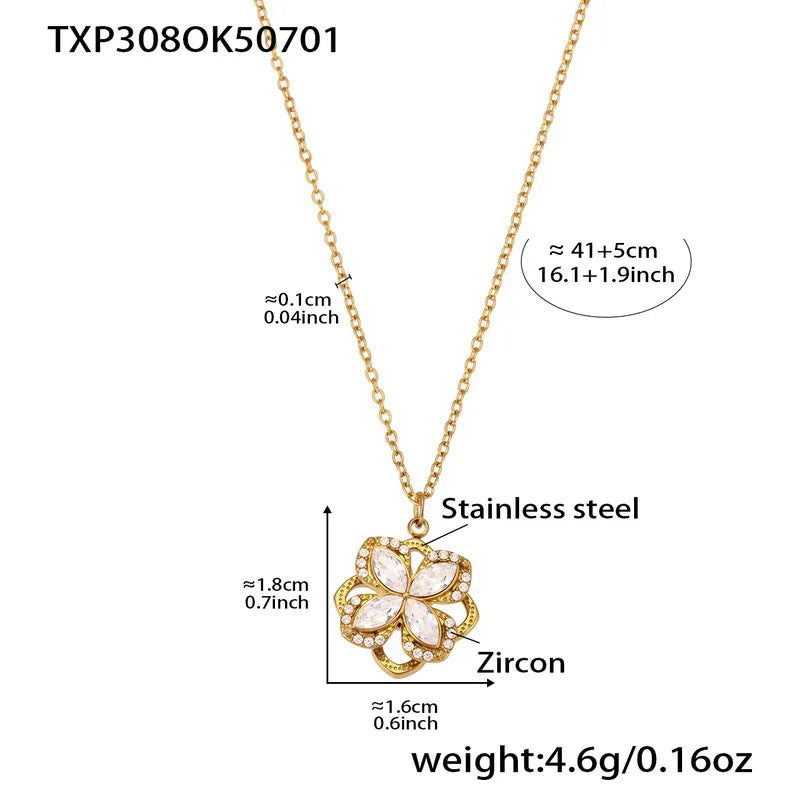 Gold necklace with floral pendant and measurements on a white background