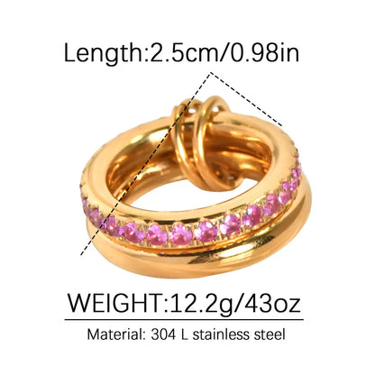Gold ring with pink stones and measurements on a white background