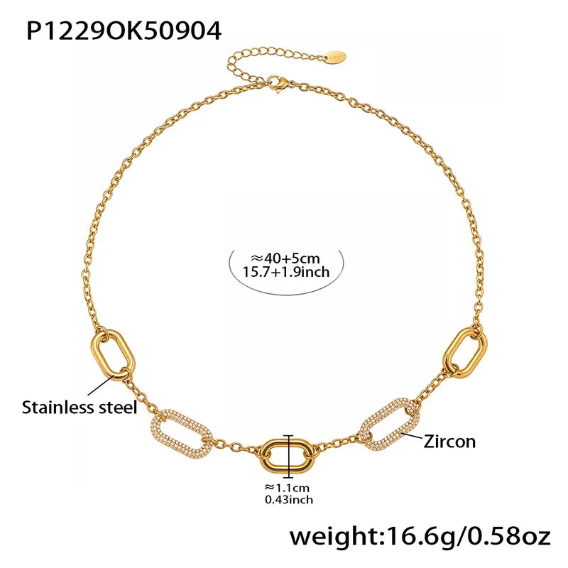 Gold necklace with chain links, zircon, and stainless steel components on a white background.