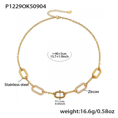 Gold necklace with chain links, zircon, and stainless steel components on a white background.