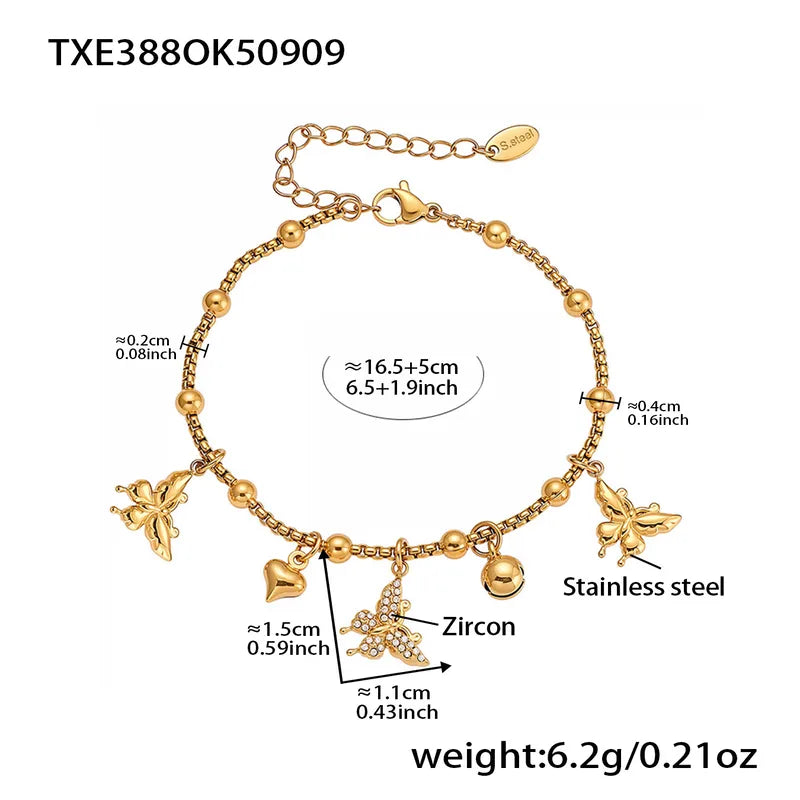 Gold bracelet with charms and measurements on a white background