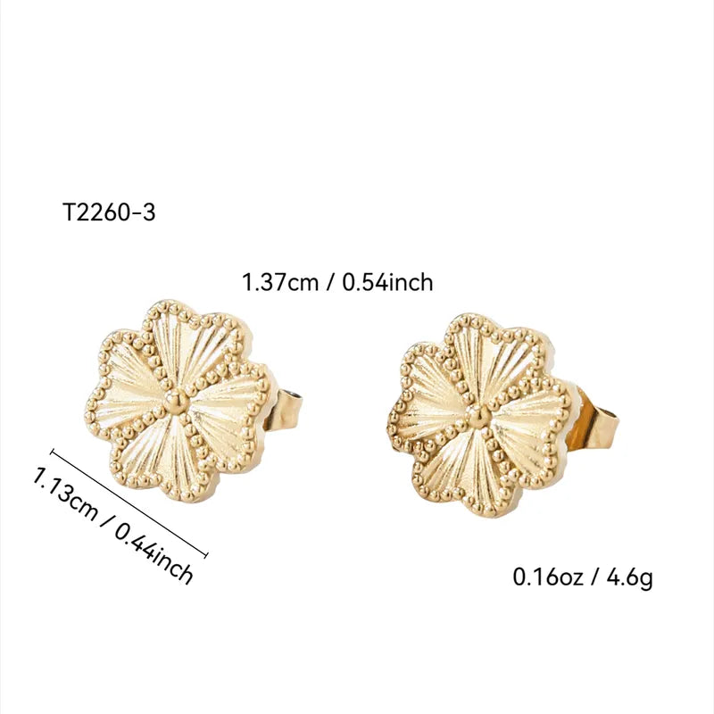 Gold earrings with measurements on a white background
