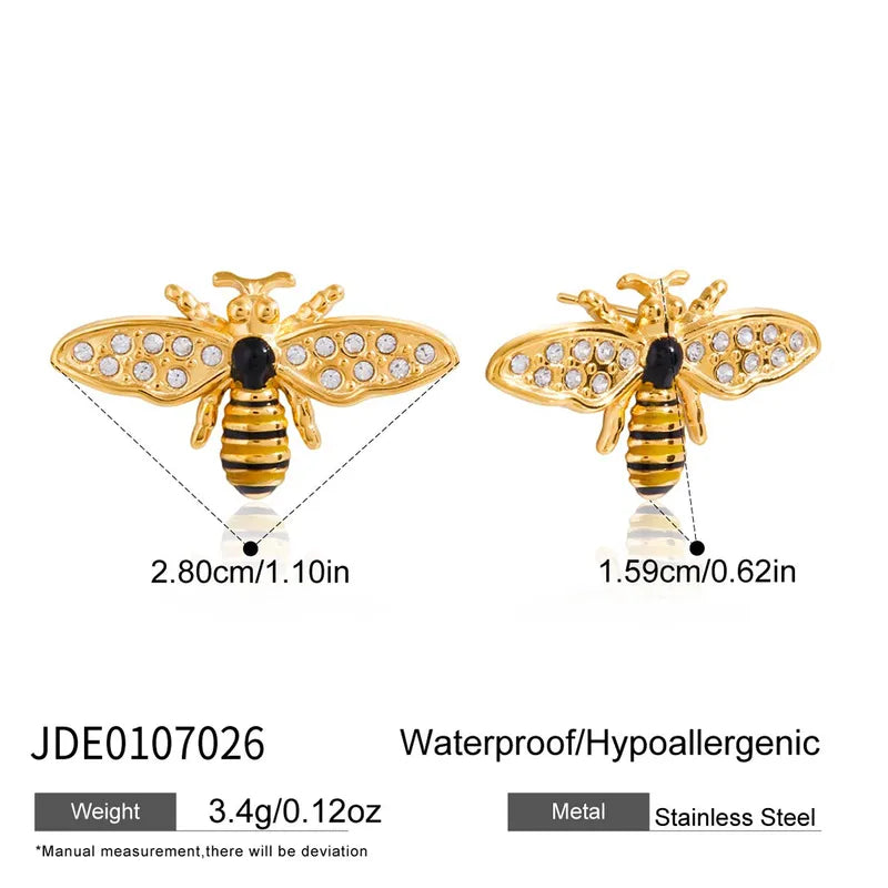 Gold bee-shaped earrings with measurements and product details on a white background