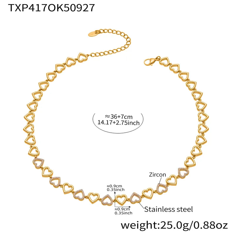 Gold heart-shaped necklace with measurements and material details on a white background