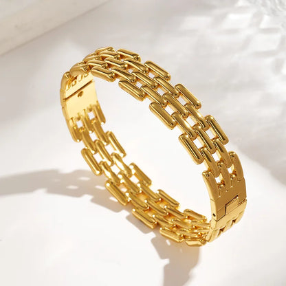 Gold chain bracelet on a white background