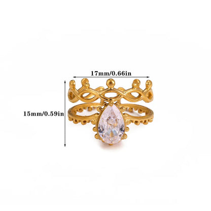 Gold ring with a teardrop-shaped gemstone and measurements on a white background