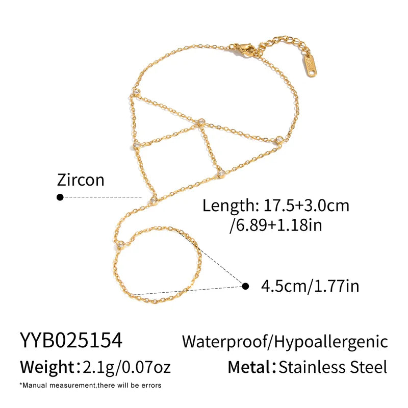 Gold chain necklace with zircon details on a white background