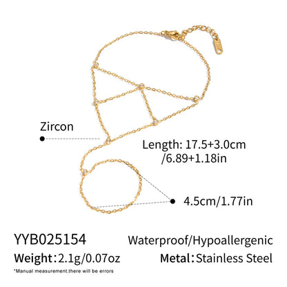 Gold chain necklace with zircon details on a white background