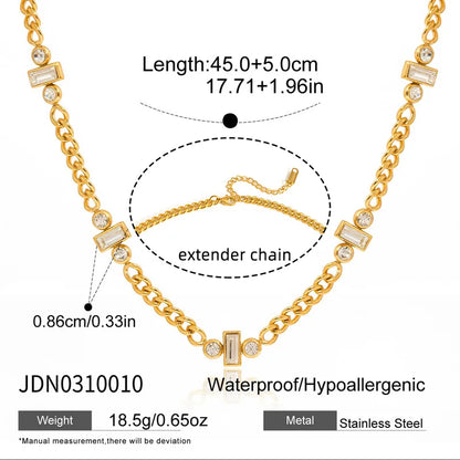 Gold necklace with extender chain on a white background