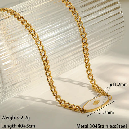 Gold chain necklace with measurements on a light background