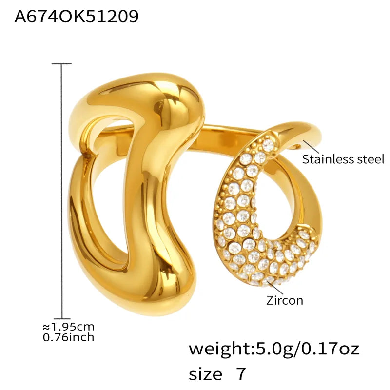 Gold ring with zircon details and measurements on a white background