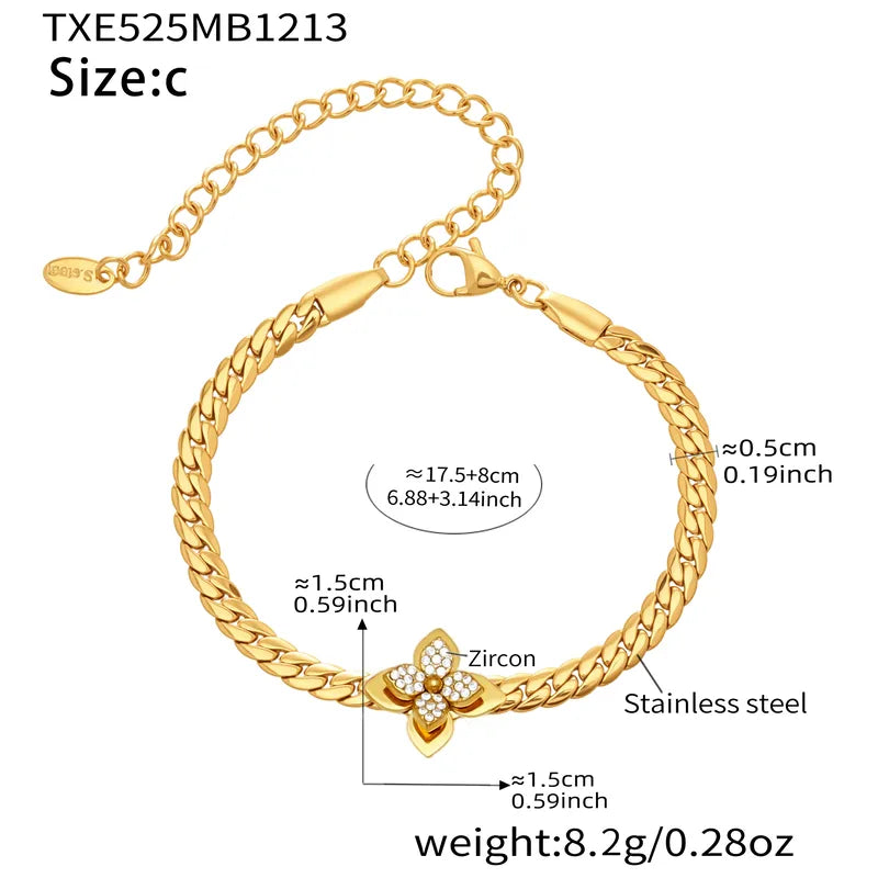 Gold bracelet with butterfly design and measurements on a white background