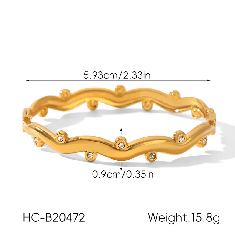 Gold bracelet with measurements and weight details on a white background