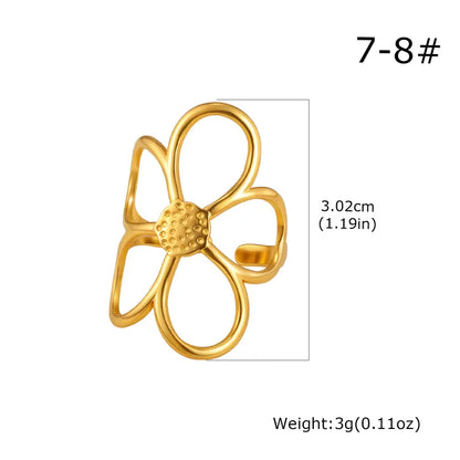Gold flower-shaped ring with measurements and weight on a white background