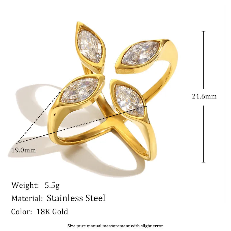Gold ring with clear gemstones and measurements on a white background
