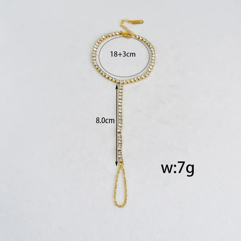 Gold chain with measurements on a white background