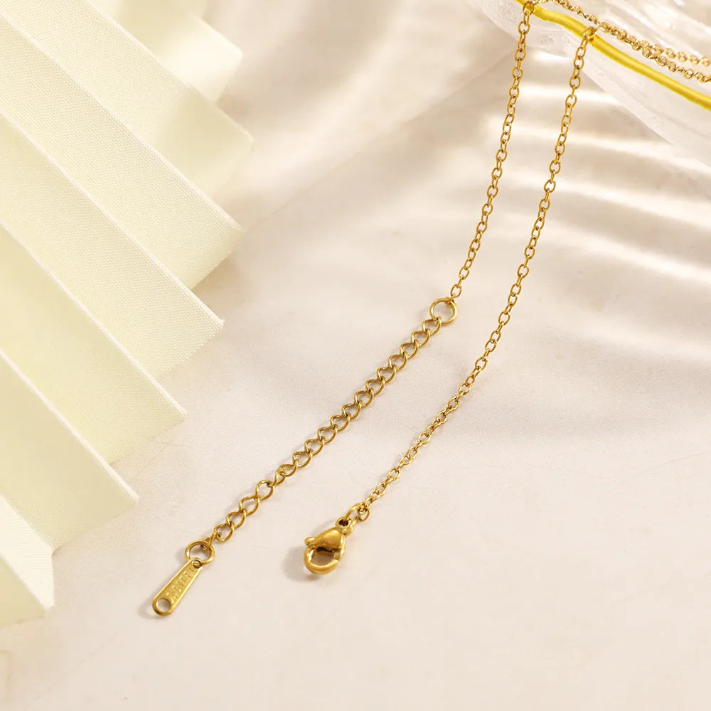 Gold chain necklace on a white background